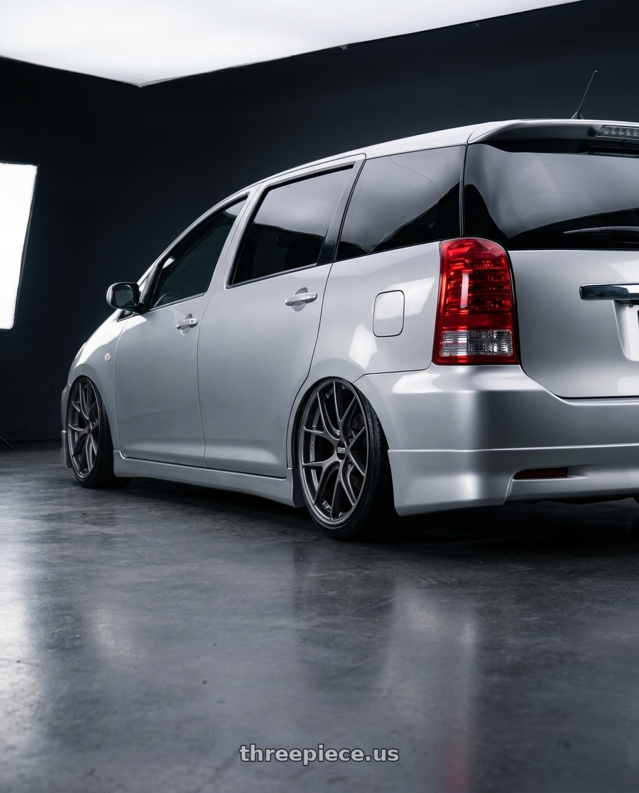 2004 Toyota wish with BBS FI 5x114.3 20x8.75 +44 Titanium wheels rear three quarter view slight stretch tires