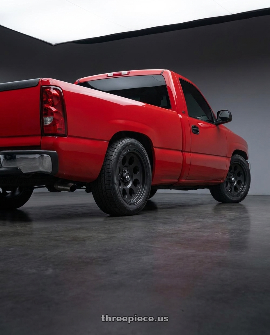 2004 gmc sierra 1500 with G-FX TR-16 6x139.7 18x9+12 Matte Black wheels rear three quarter view square tires