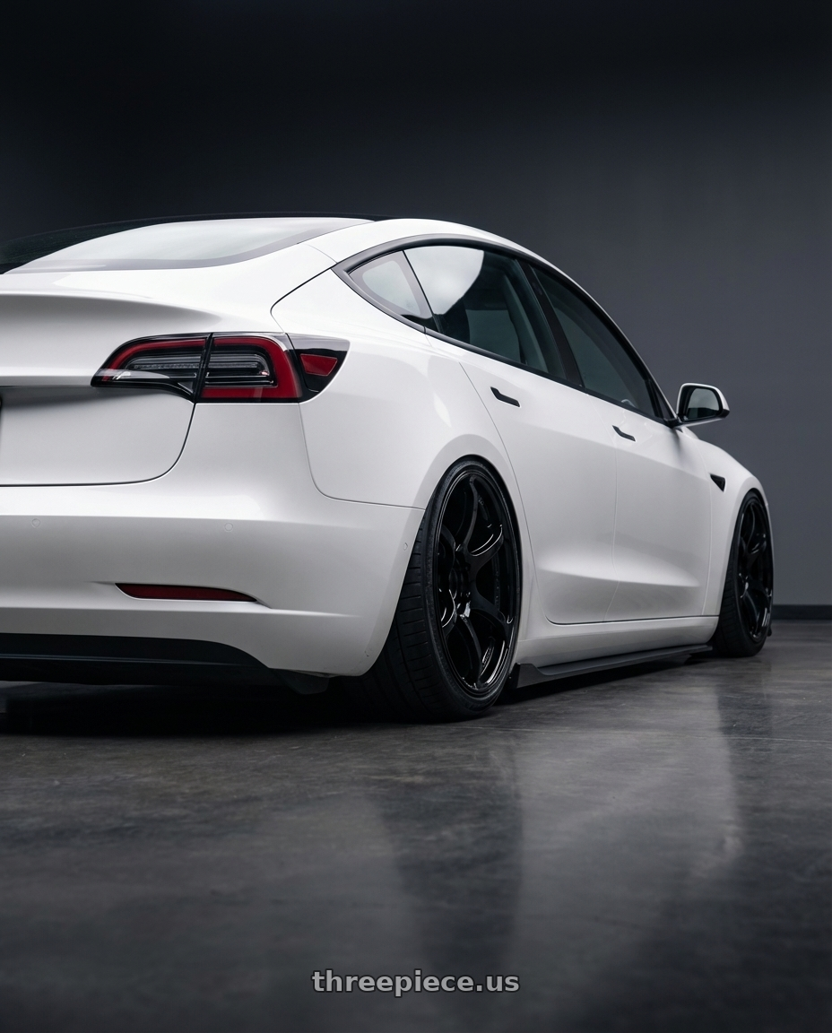 2023 Tesla Model 3 with Advan RGIII 5x114.3 19x9.0+35 Gloss Black wheels rear three quarter view slight stretch tires