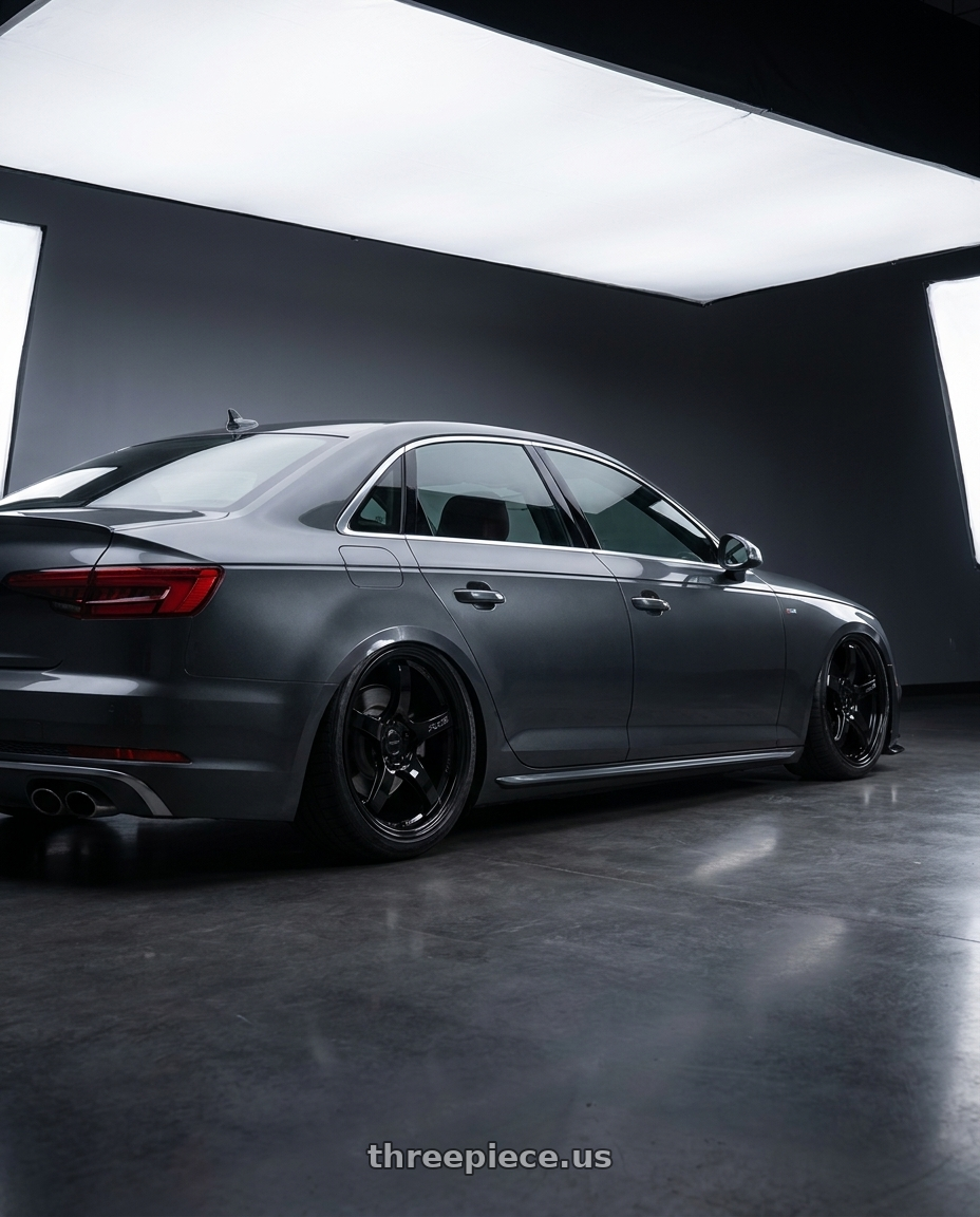 2023 Audi S4 B9 with Gram Lights 57CR 5x112 19x10.5+22 Glossy Black wheels rear three quarter view slight stretch tires