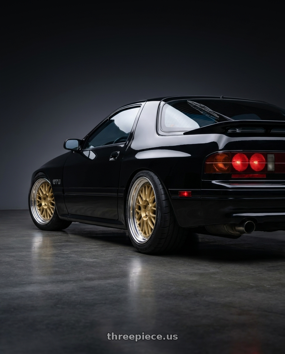 1990 Mazda RX7 GTU black with Work Brombacher Mesh wheels rear three quarter view meaty tires