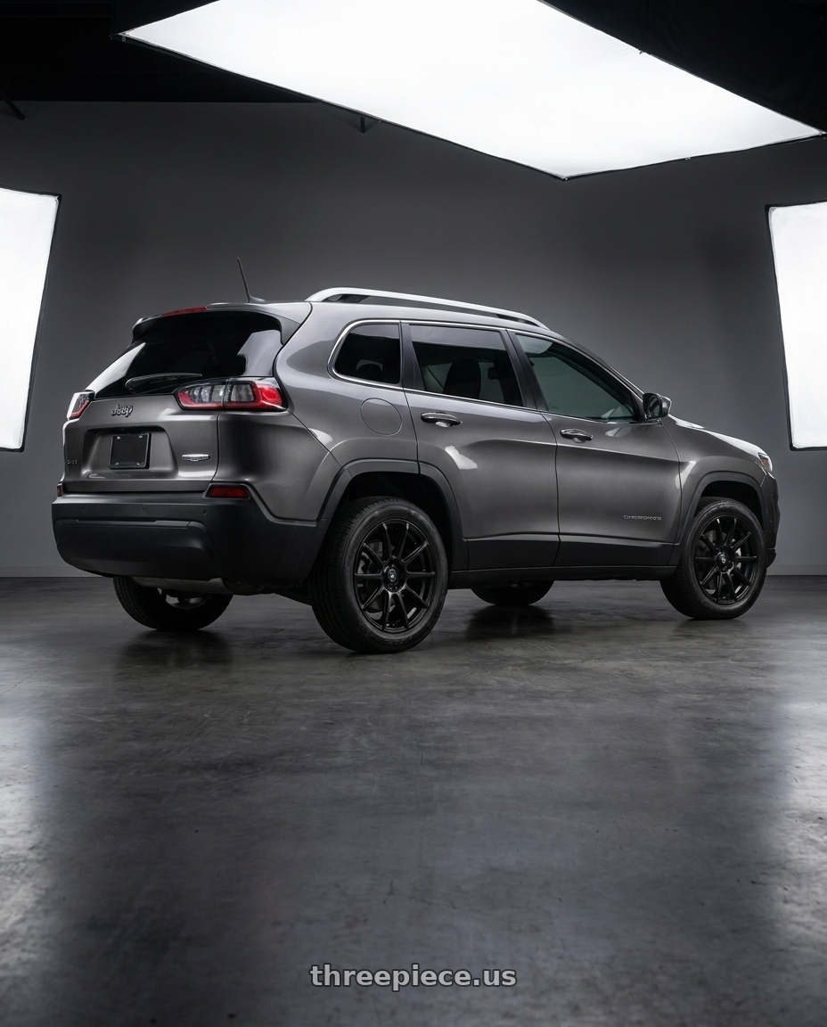 2019 Jeep Cherokee Latitude with Konig Control 5x110/5x115 17x7+40 Matte Black wheels rear three quarter view square tires