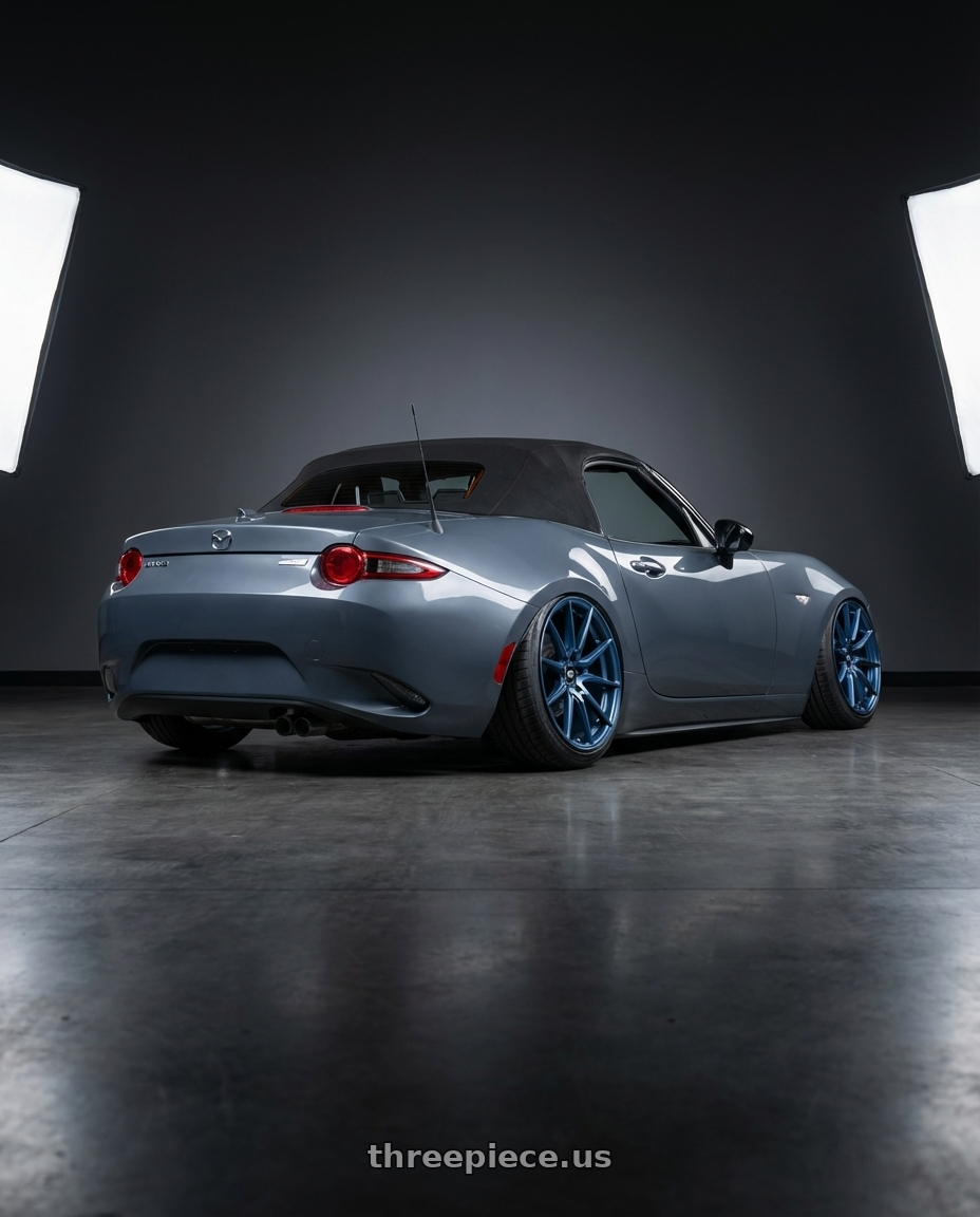 2021 Mazda mx-5 gt gray  with MST Wheels DELTA 5X112 18X8.5 +43 Cerulean Blue Pearl wheels rear three quarter view extreme stretch tires