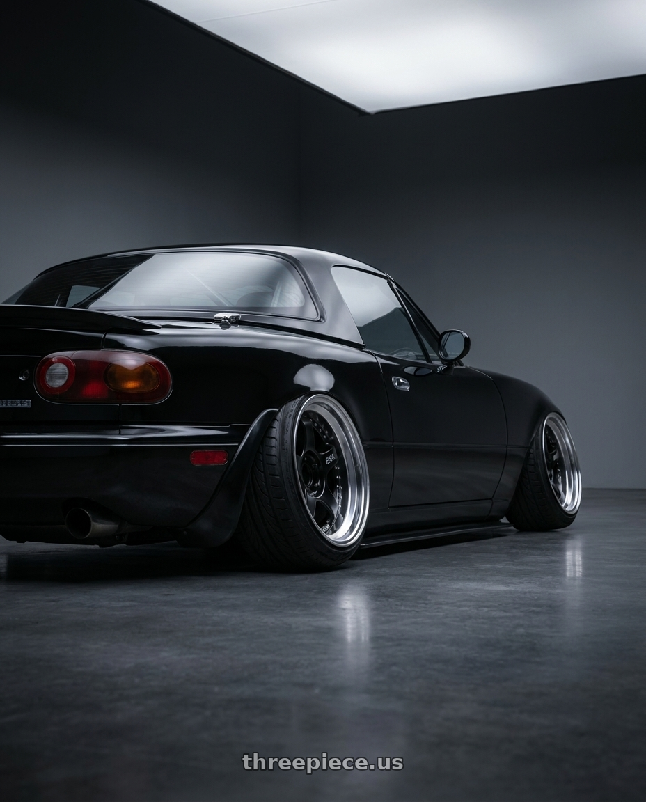 1993 Mazda Miata with SSR Professor SP1R 4X100 16X9.5 19 NR Disk Black wheels rear three quarter view extreme stretch tires