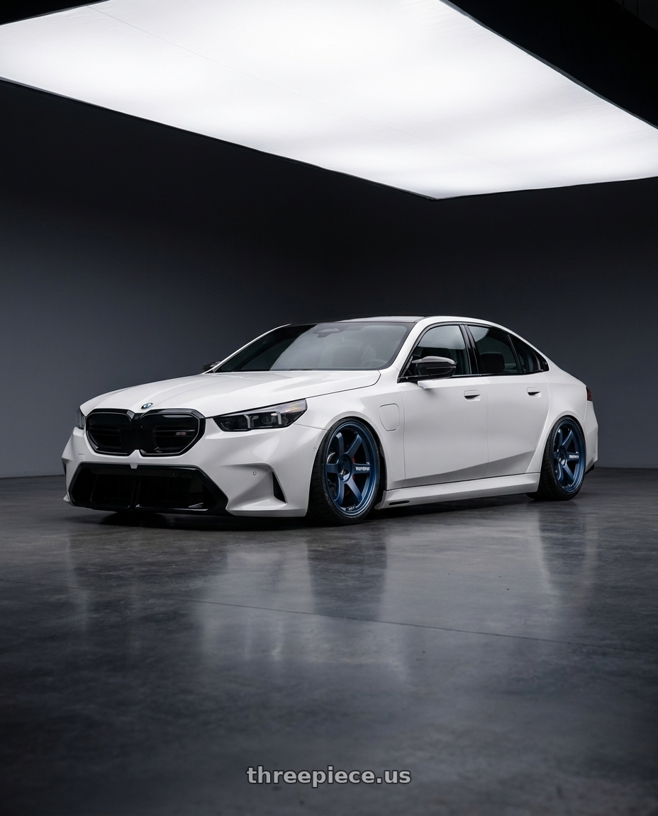 2025 bmw m5 white with Volk Racing TE37 SAGA S-PLUS 5x114.3 19x10.5 +15 MAG BLUE wheels