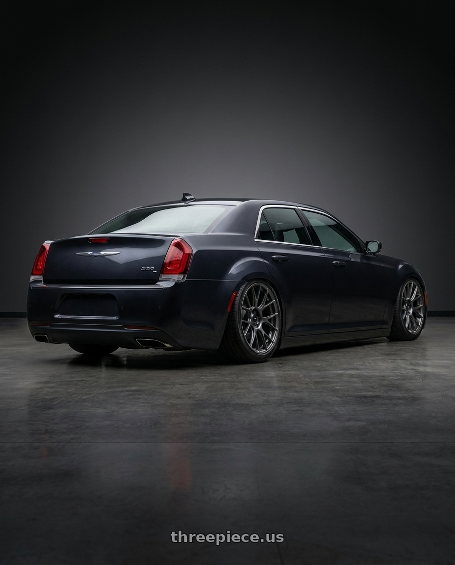 2021 Chrysler 300c with Konig Ampliform 5x115 20x11+21 Dark Metallic Graphite wheels rear three quarter view slight stretch tires