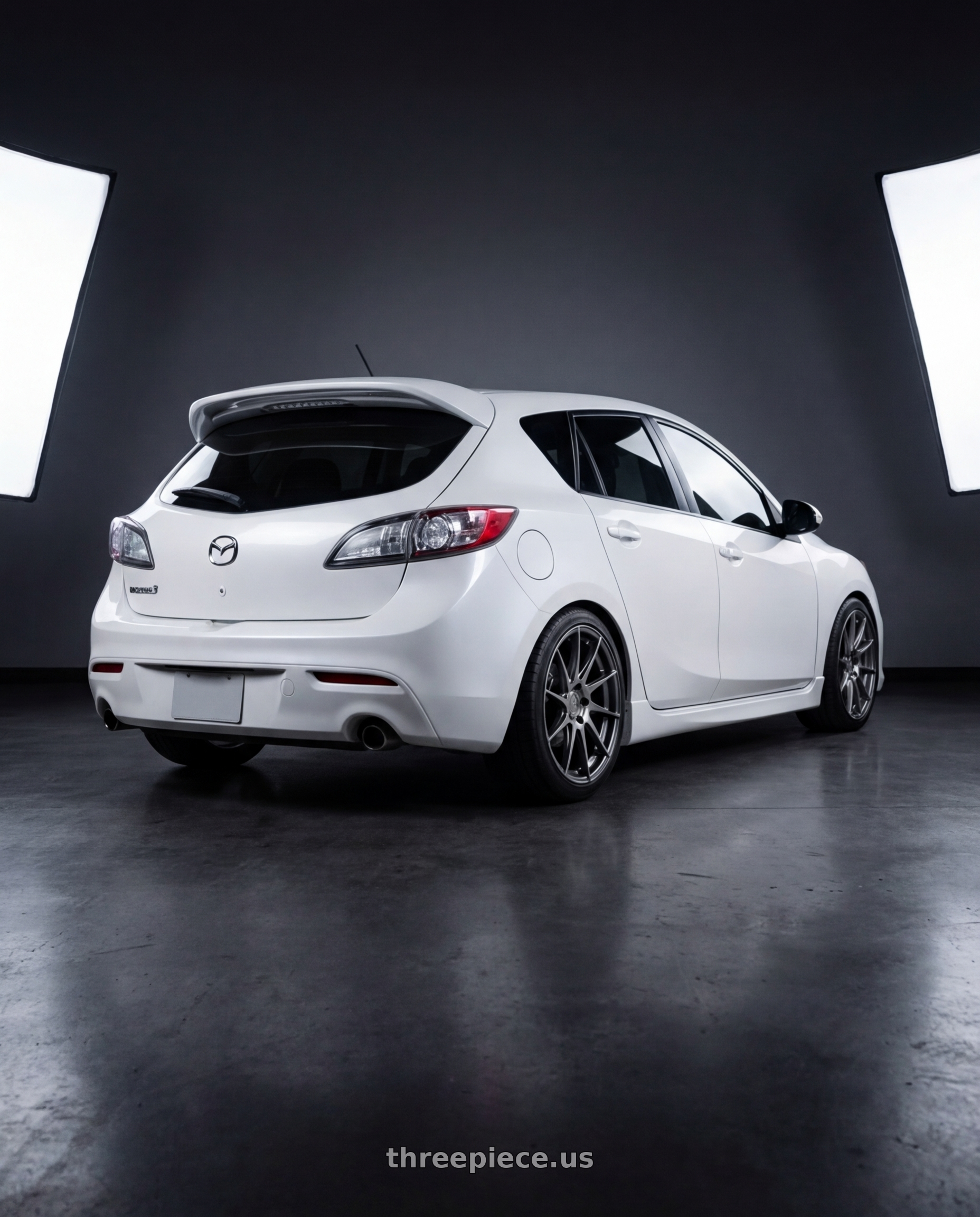 2012 Mazda Mazdaspeed3 with Aodhan AH09 5x114.3 18x8.5 +35 Hyper Black wheels rear three quarter view square tires