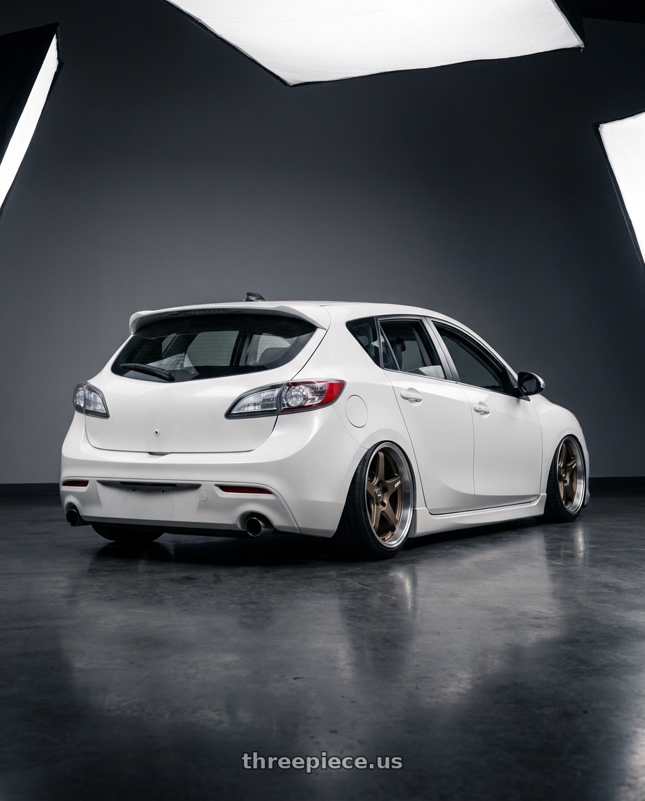2012 Mazda Mazdaspeed3 with ESR Wheels APEX SERIES AP5 5x114.3 18x9.5 +35 Matte Bronze wheels rear three quarter view slight stretch tires