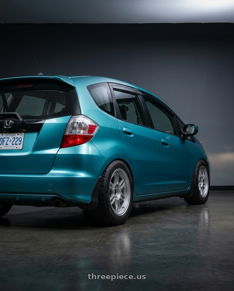 2014 Honda Fit with Enkei RPF1 4x100 16x7+35 Silver wheels rear three quarter view meaty tires
