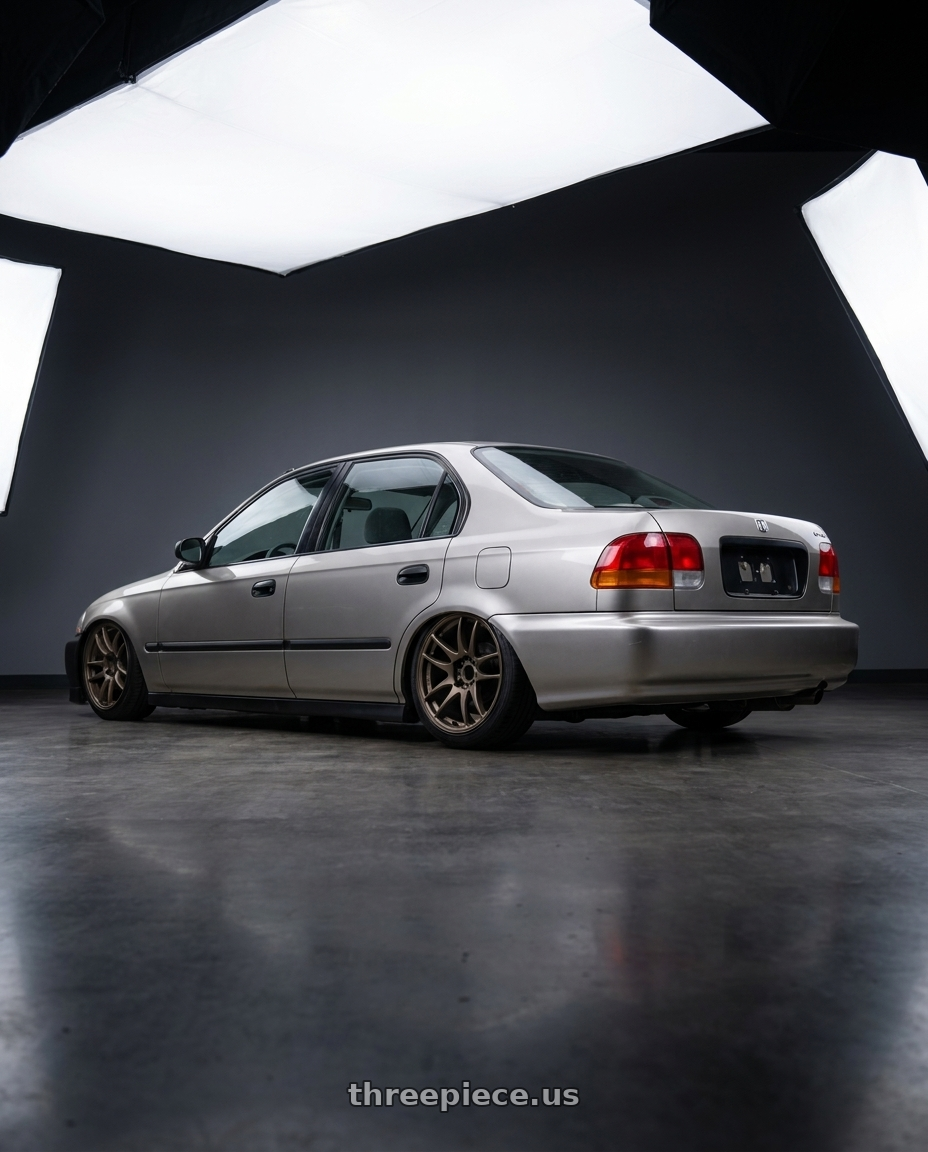 2000 honda civic dx sedan with Work Emotion Cr Kiwami 4x100 16x6.5 +42 Matte Bronze wheels rear three quarter view slight stretch tires