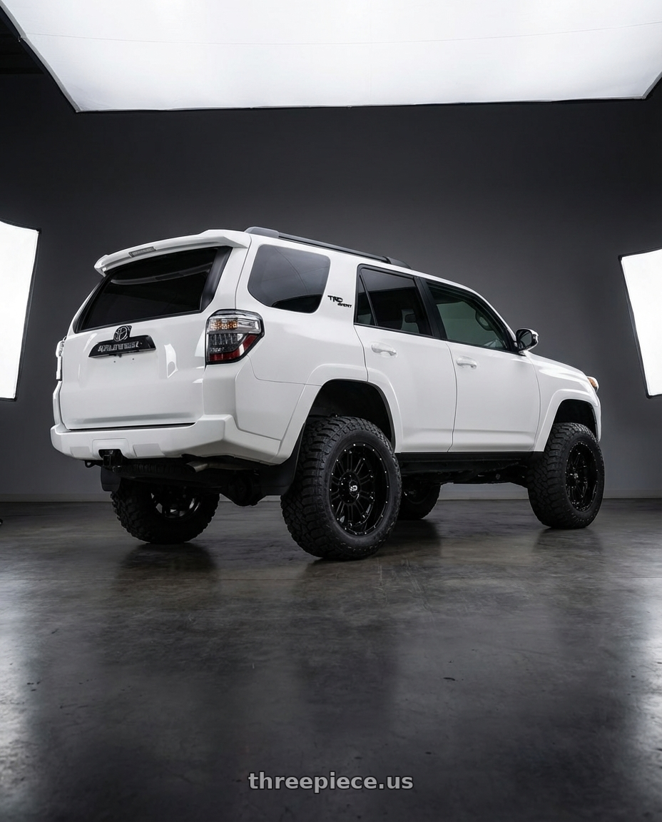 2022 Toyota 4Runner with XD XD829 HOSS II 6X139.7 20X10 -24 GLOSS BLACK wheels rear three quarter view meaty tires