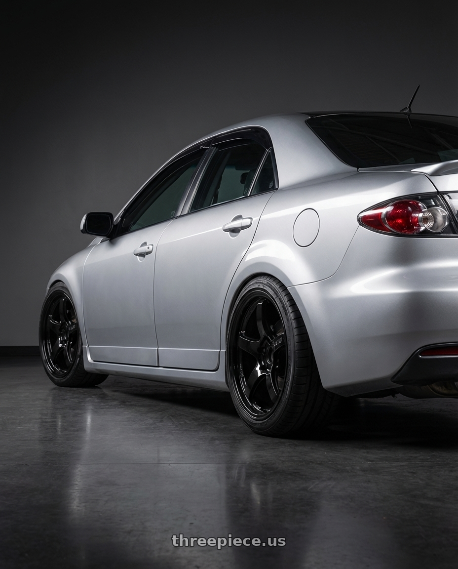 2006 mazda speed6  with Gram Lights 57CR 5x100 18x9.5+38 Glossy Black wheels rear three quarter view square tires