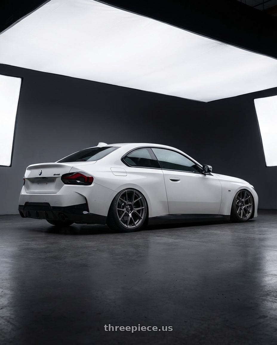 2024 BMW 2 Series G42 with Konig Ampliform 5x112 19x8.5+32 Dark Metallic Graphite wheels rear three quarter view slight stretch tires