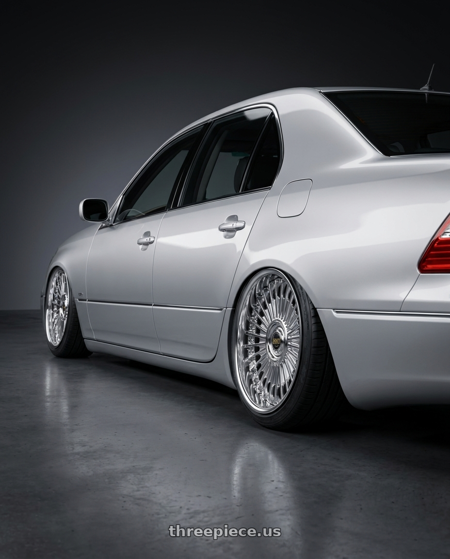 2004 Lexus ls430 with Work Emitz wheels rear three quarter view slight stretch tires