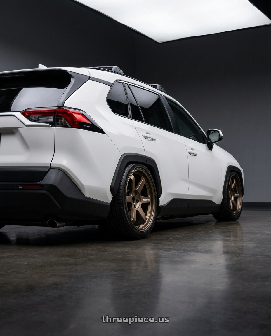 2023 rav4 white  with Volk Racing TE37 Ultra M Spec 5x112 19x9.5+23 19x10.5+35 Bronze Almite Toyota Supra MK5 Spec wheels rear three quarter view square tires