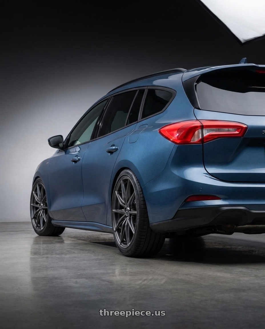 2023 Focus Wagon Mk45 Blue Metallic with Enkei DRACO 5x120 18x8.0+35 Anthracite wheels rear three quarter view square tires