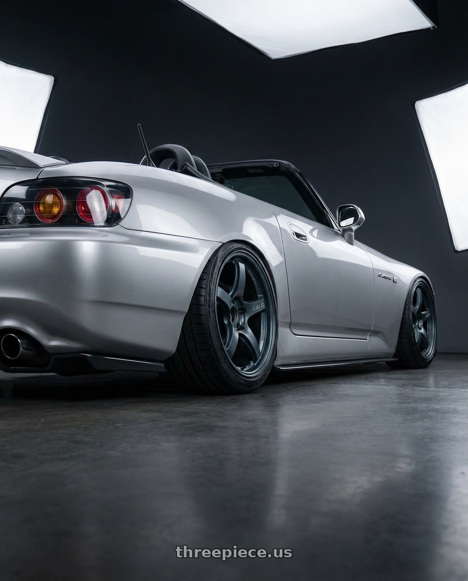 2009 Honda S2000 with Gram Lights 57CR 5x114.3 17x9+38 Gunblue II wheels rear three quarter view slight stretch tires