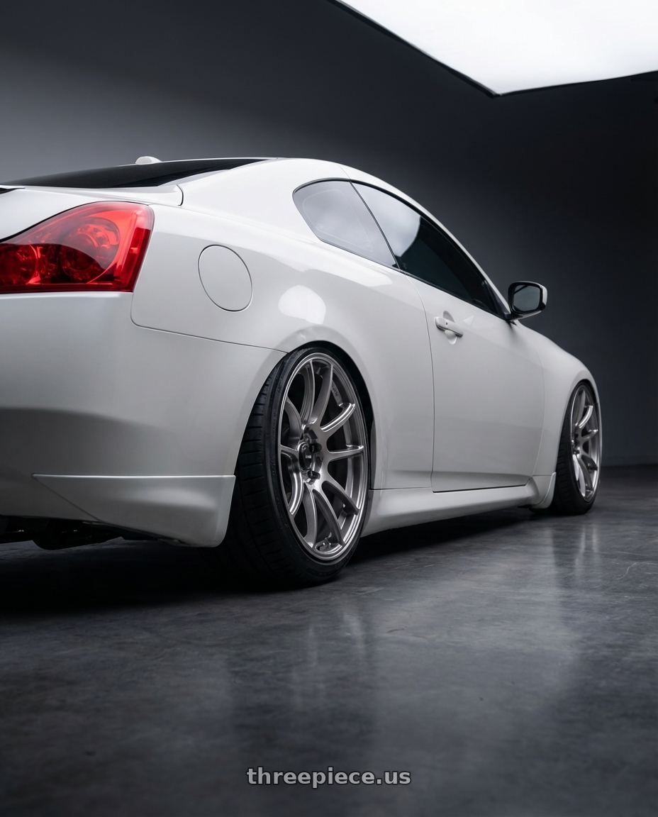 2014 Infiniti G37 Coupe with Konig Heliogram 5X114.3 19x9.5+35 Titanium Metallic Knurled Bead Flow Formed wheels rear three quarter view slight stretch tires
