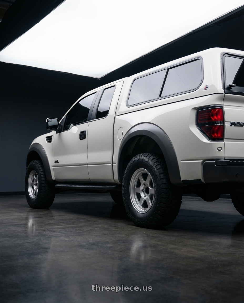 2013 Ford SVT Raptor SuperCab with Volk Racing TE37XT M-SPEC 6x139.7 17x8.5 -10 DIAMOND SILVER wheels rear three quarter view square tires