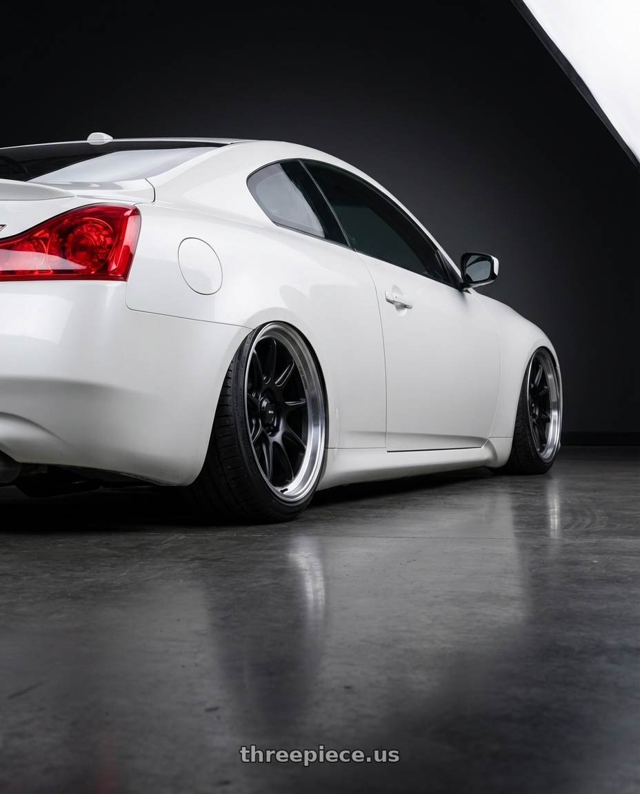 2014 Infiniti G37 Coupe with Konig Countergram 5x114.3 19x11+18 Matte Black / Matte Machined Lip wheels rear three quarter view slight stretch tires