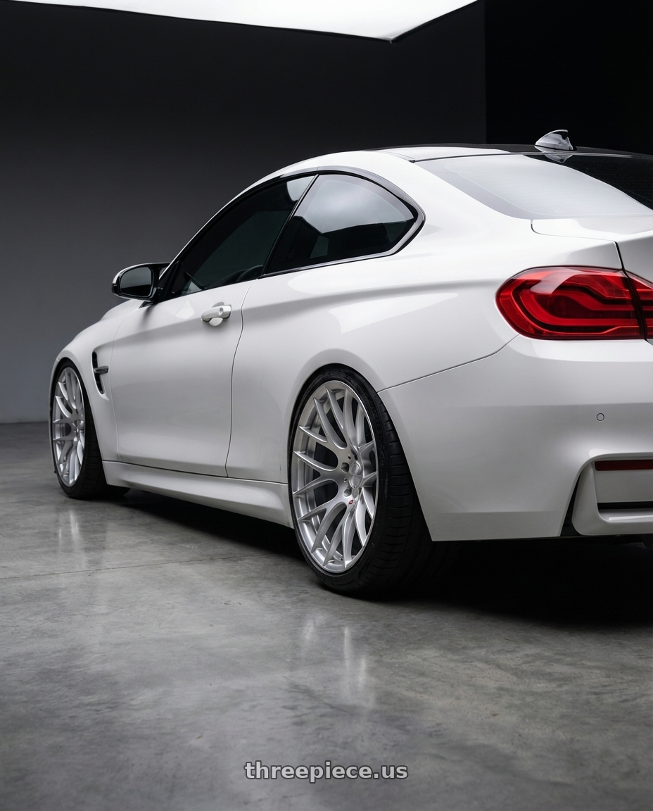 2018 BMW M4 F82 with Avant Garde Wheels M359 5X120 19x10 +25 Hyper Silver wheels rear three quarter view slight stretch tires