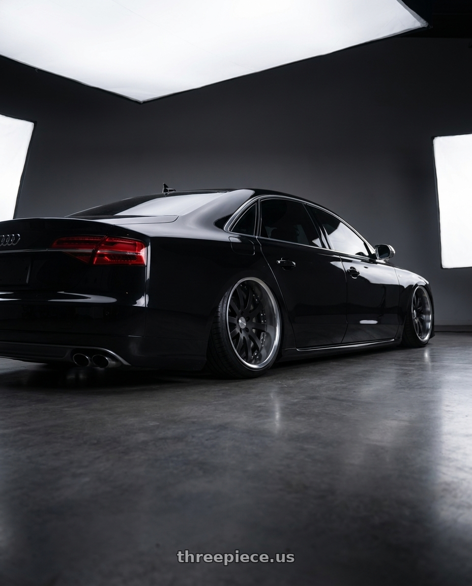 2016 Audi S8 with Work Equip E10 5x112 22x11.5+14 a disk Black Anodized wheels rear three quarter view extreme stretch tires