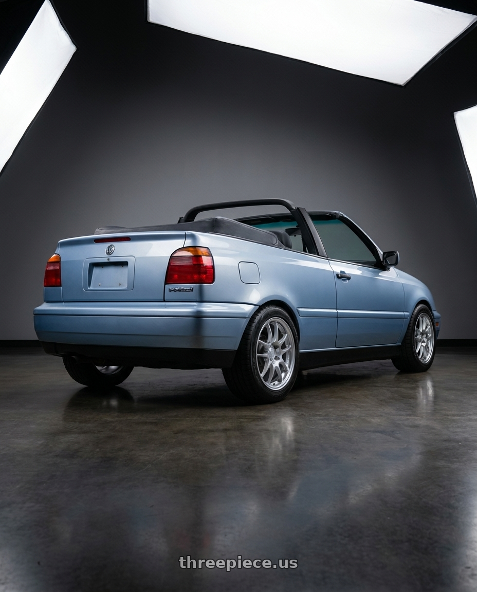 1998 volkswagen cabrio light blue  with Enkei PF01 4x100 15x7+35 Silver wheels rear three quarter view meaty tires
