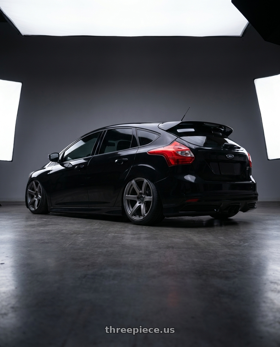 2013 black focus st  with Enkei Cyclone 6x139.7 17x9+0 Matte Gunmetal wheels rear three quarter view slight stretch tires