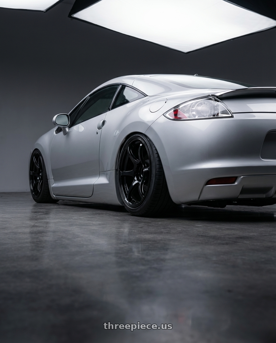 2010 Mitsubishi Eclipse with Advan RGIII 5x114.3 19x9.5+45 Gloss Black wheels rear three quarter view slight stretch tires