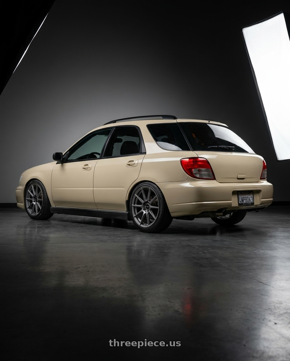 2002 subaru wrx wagon with Enkei TS10 5x100 17x9+45 Grey wheels rear three quarter view slight stretch tires