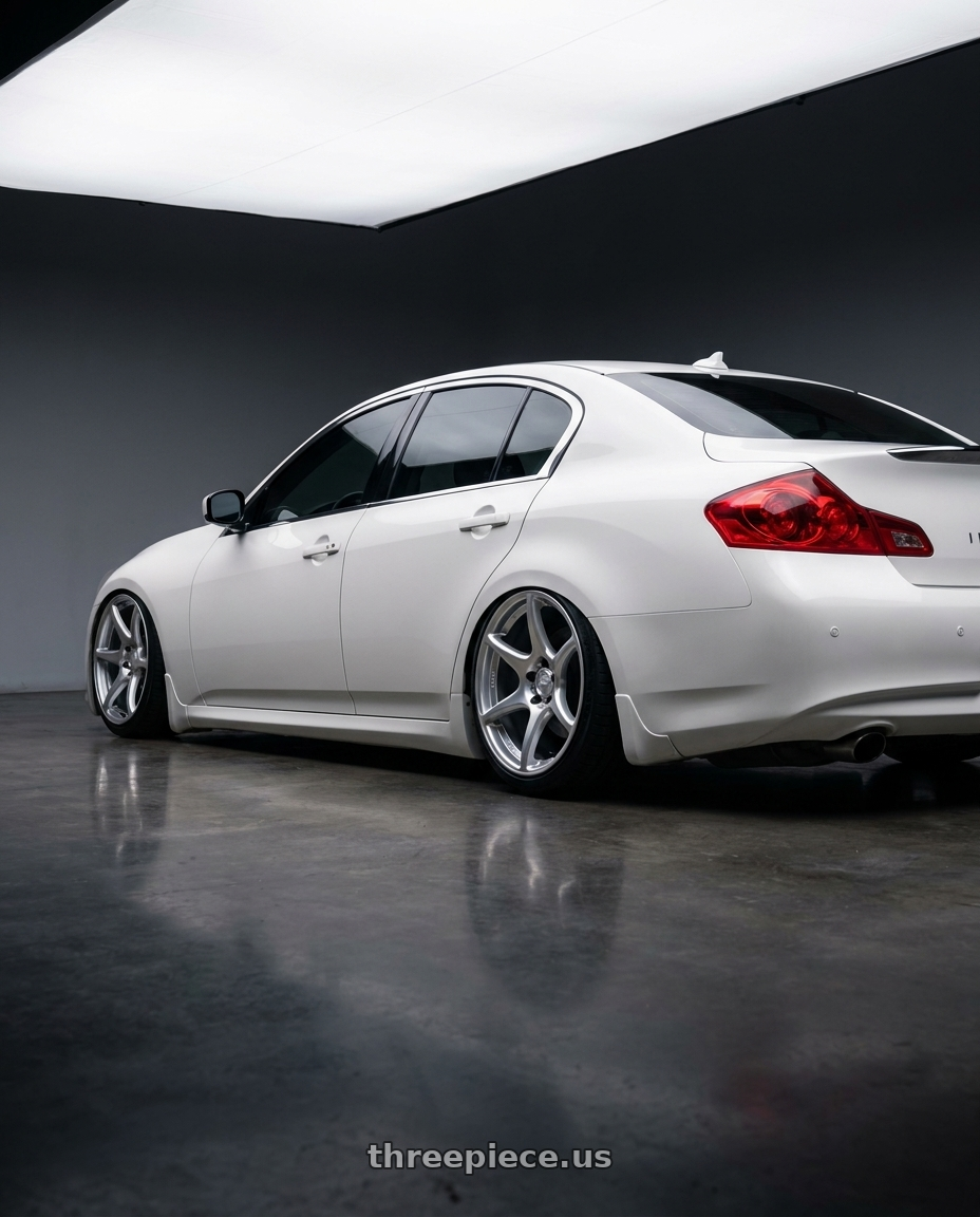 2012 Infiniti G37 with Kansei K11S Tandem 5x114.3 19x9.5 22 Hyper Silver wheels rear three quarter view slight stretch tires