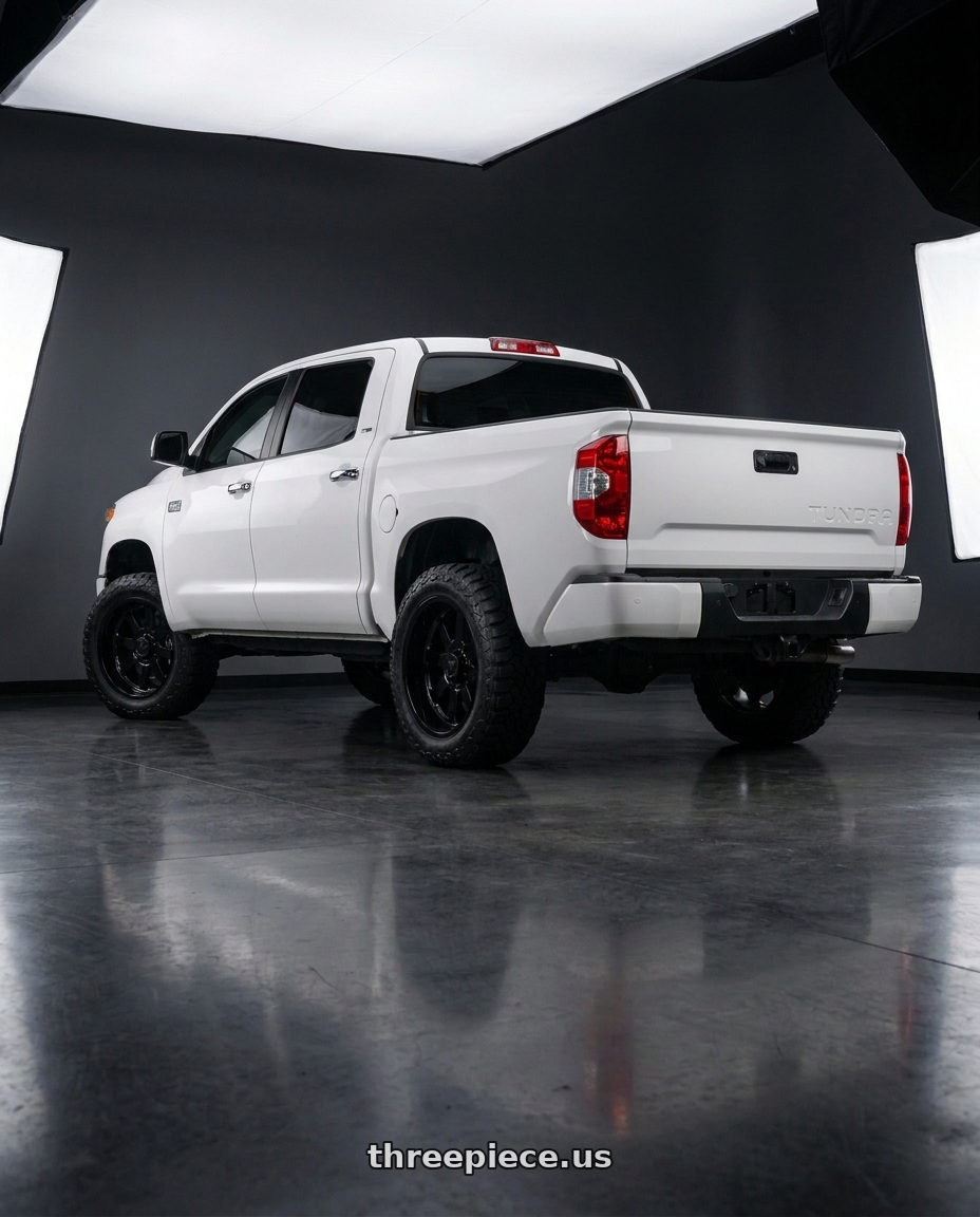 2016 toyota tundra platinum with Fittipaldi Offroad FA16B 5x139.7/5X150 22x12 -51 Gloss Black wheels rear three quarter view slight stretch tires