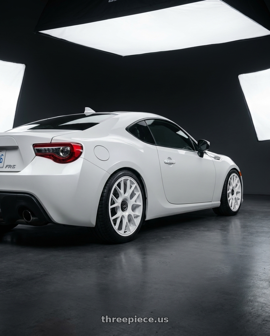 2016 Scion FR-S with fifteen52 APEX 5x100 / 5x112 17x7.5 +35 RALLY WHITE (GLOSS WHITE) wheels rear three quarter view square tires