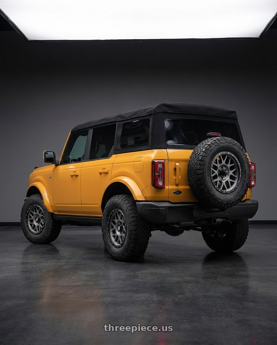 2024 Ford Bronco with XD XD127 BULLY 6X139.7 17X8.5 +0 MATTE GRAY BLACK RING wheels rear three quarter view meaty tires