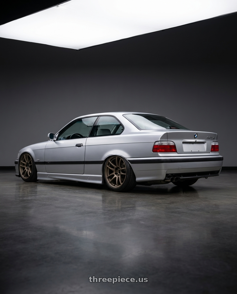 1999 BMW 323is with Work Emotion Cr Kiwami 5x120 17x8 +35 Matte Bronze wheels rear three quarter view square tires