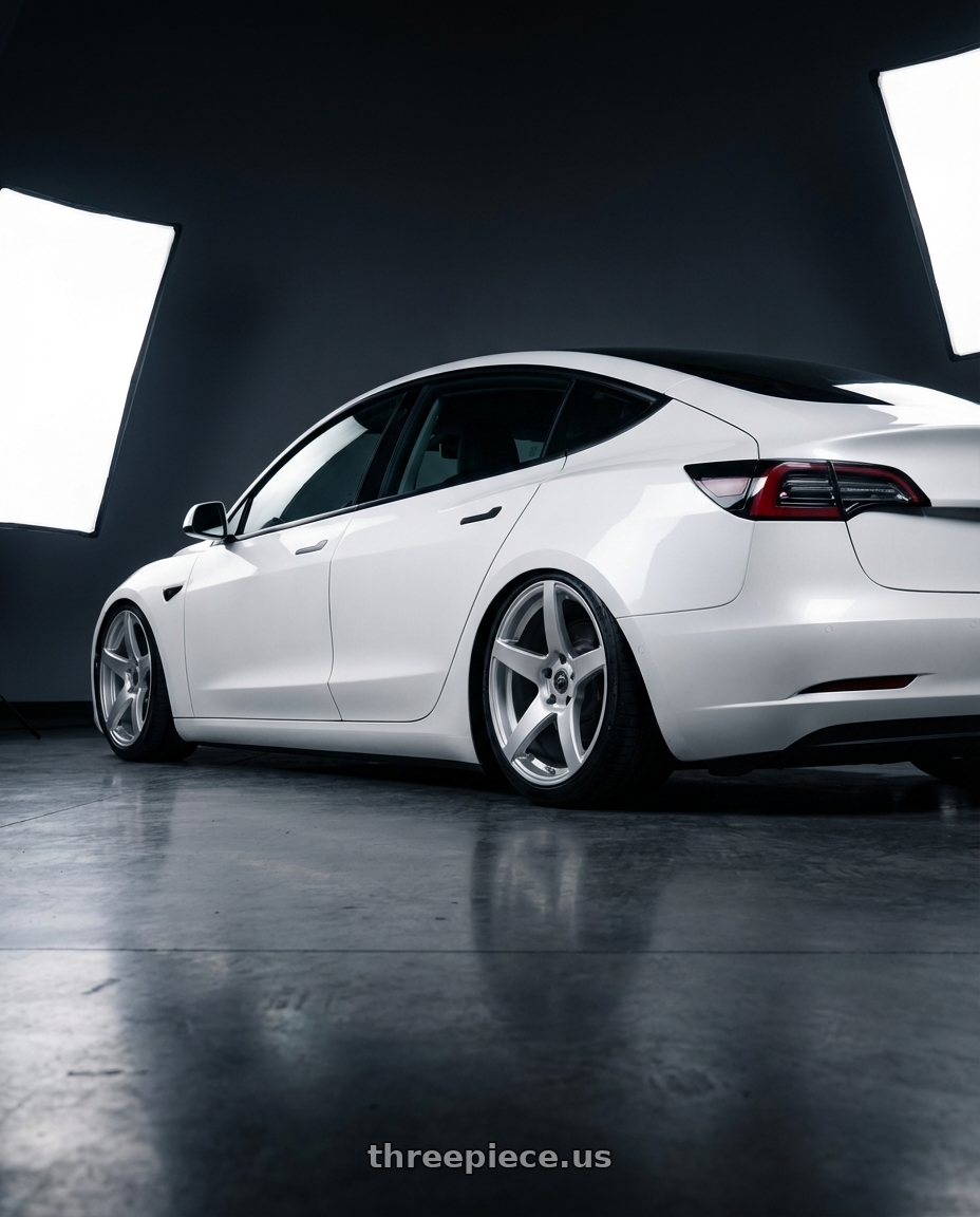 2023 Tesla Model 3 with Forgestar CF5 5x114.3 19x9.5 +29 Gloss Silver wheels rear three quarter view slight stretch tires