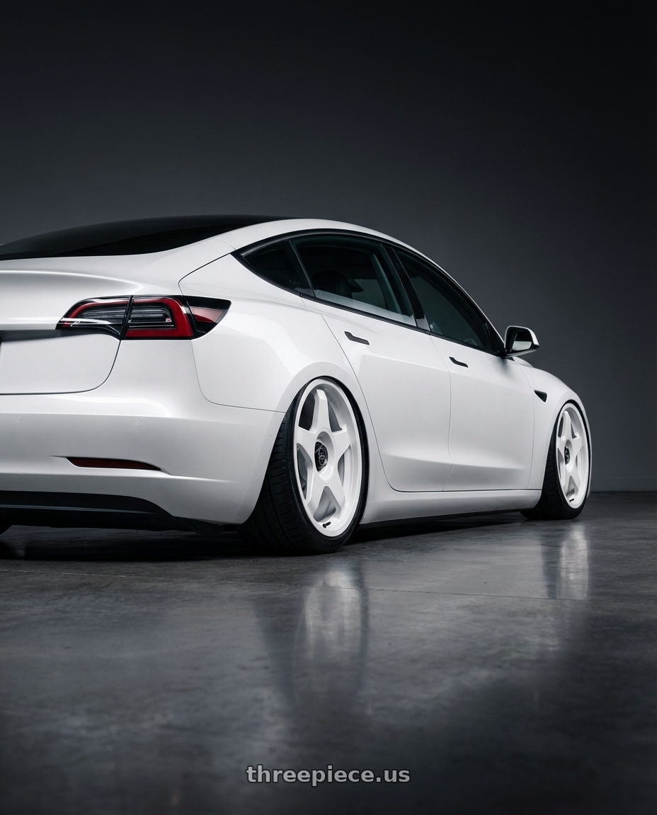 2023 Tesla Model 3 with fifteen52 CHICANE 5x114.3 / 5x120 19x8.5 +35 RALLY WHITE (GLOSS WHITE) wheels rear three quarter view slight stretch tires