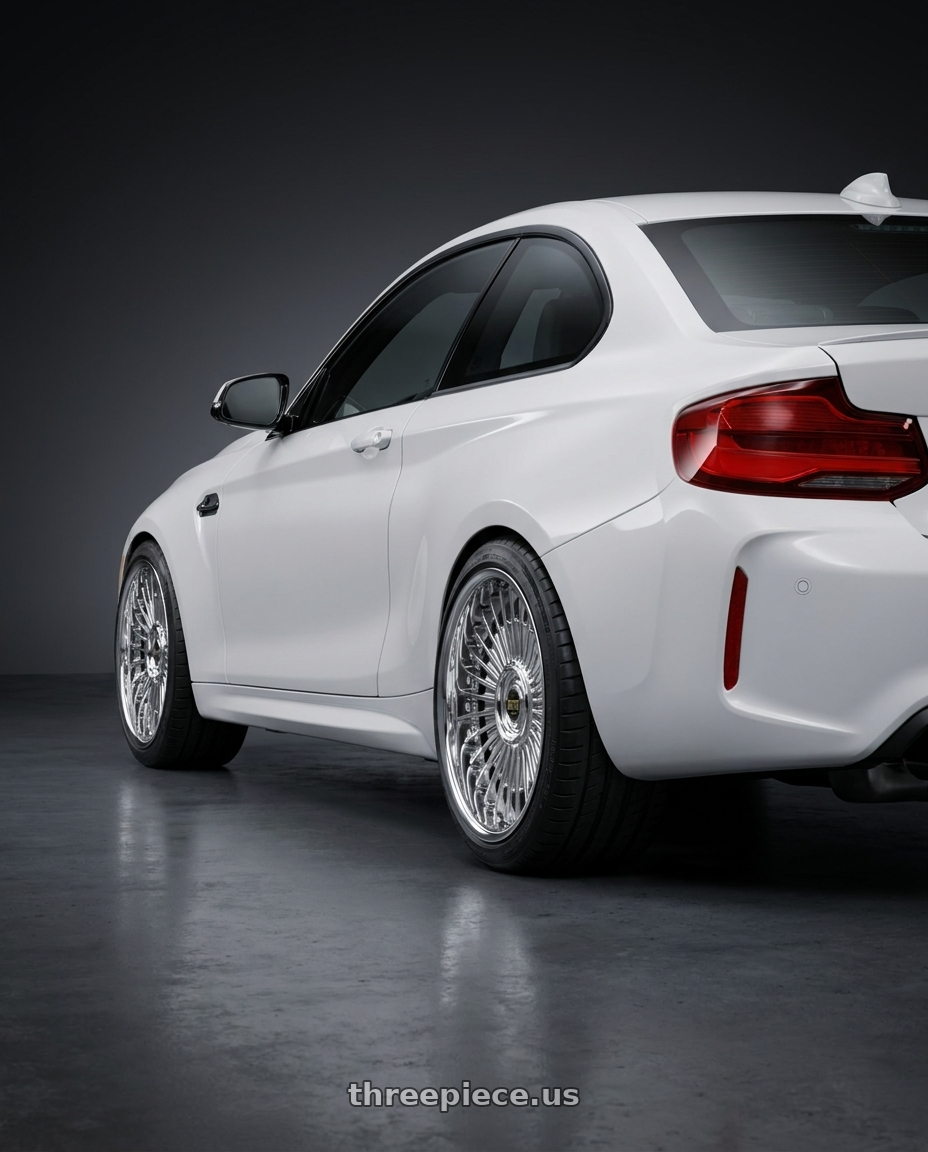 2018 BMW M2 with Work Emitz Chrome 5x120 19x9.5 +38 wheels rear three quarter view square tires
