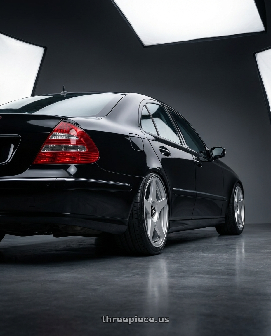 Mercedes E500 W211 2006 with fifteen52 TARMAC EVO 5x100 / 5x114.3 18x8.5 +35 SPEED SILVER (GLOSS SILVER) wheels rear three quarter view slight stretch tires