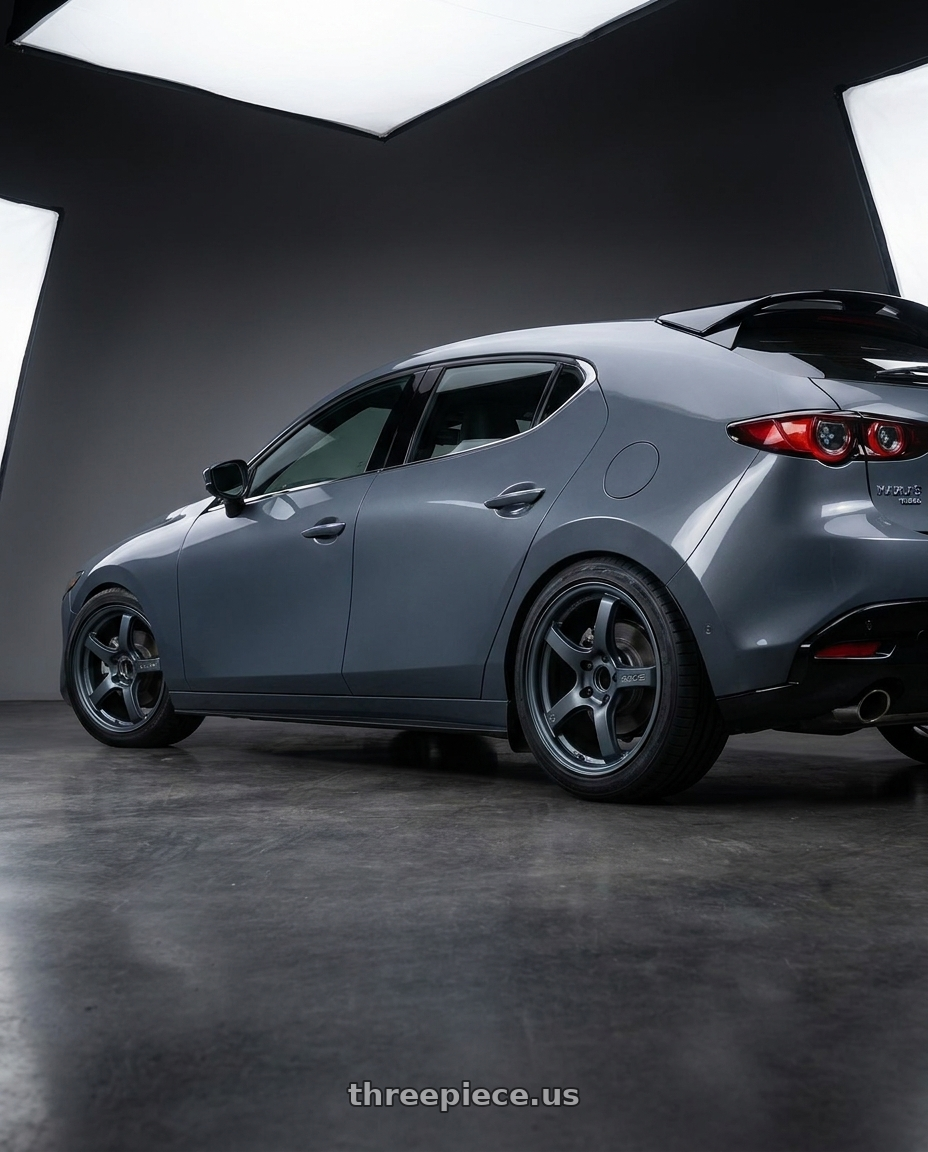 2023 Mazda Mazda3 Turbo with Gram Lights 57CR 5x114.3 18x9.5+22 Gunblue II wheels rear three quarter view square tires
