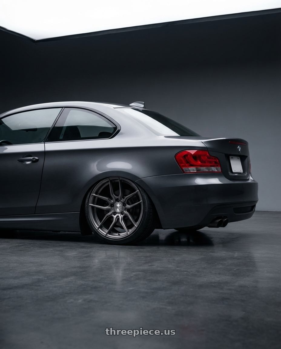 2012 BMW 1 Series E82 with Avant Garde Wheels M520R 5X120 19x8.5 +34 Dark Graphite Metallic wheels rear three quarter view slight stretch tires