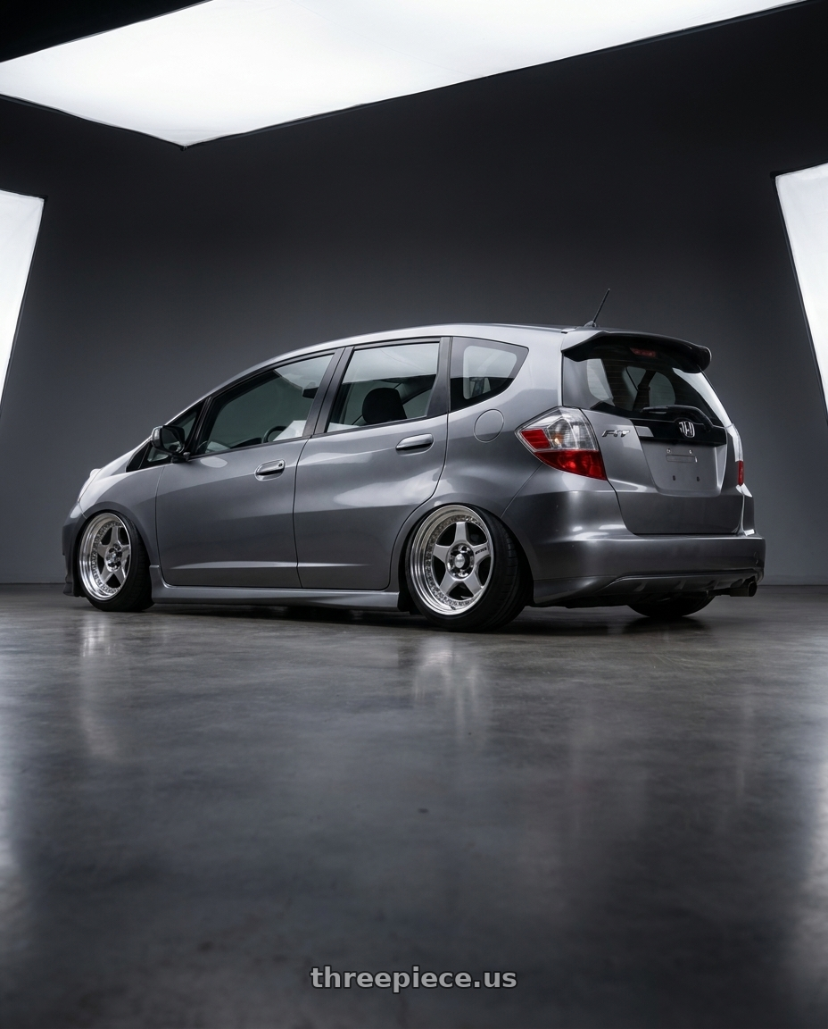2012 Honda fit sport gray with Work Meister Cr01 4x100 16x7+35 A Disk Bright Buff Finish wheels rear three quarter view meaty tires