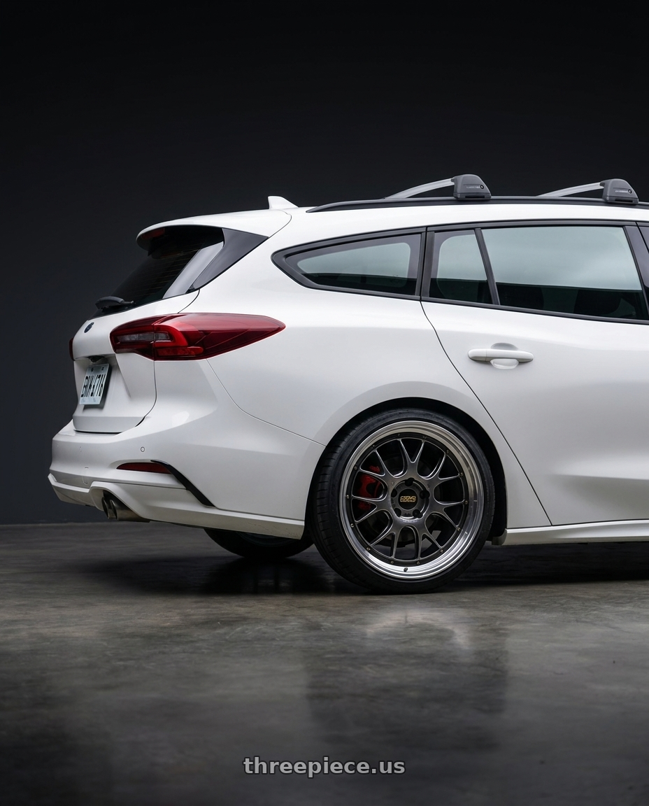 2024 focus wagon with BBS LM-R 5x120 19x8.5+32 Diamond Black wheels rear three quarter view square tires