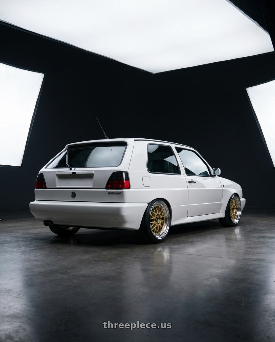 1989 Volkswagen Golf rallye with Work Brombacher Mesh wheels rear three quarter view slight stretch tires