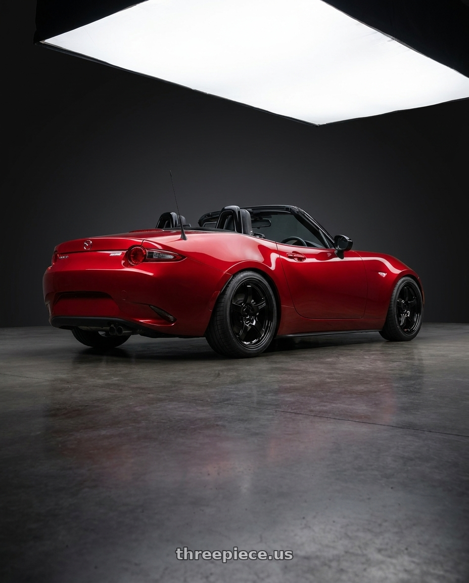 2024 mazda mx5 with Gram Lights 57CR 4x100 17x7 +38 Gloss Black wheels rear three quarter view square tires