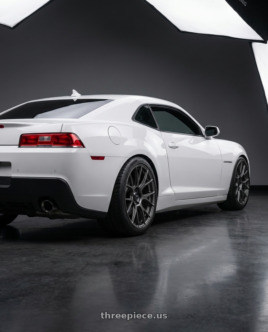 2014 Chevrolet Camaro 5th Gen with Konig Ampliform 5x120 20x8.5+45 Dark Metallic Graphite wheels rear three quarter view square tires