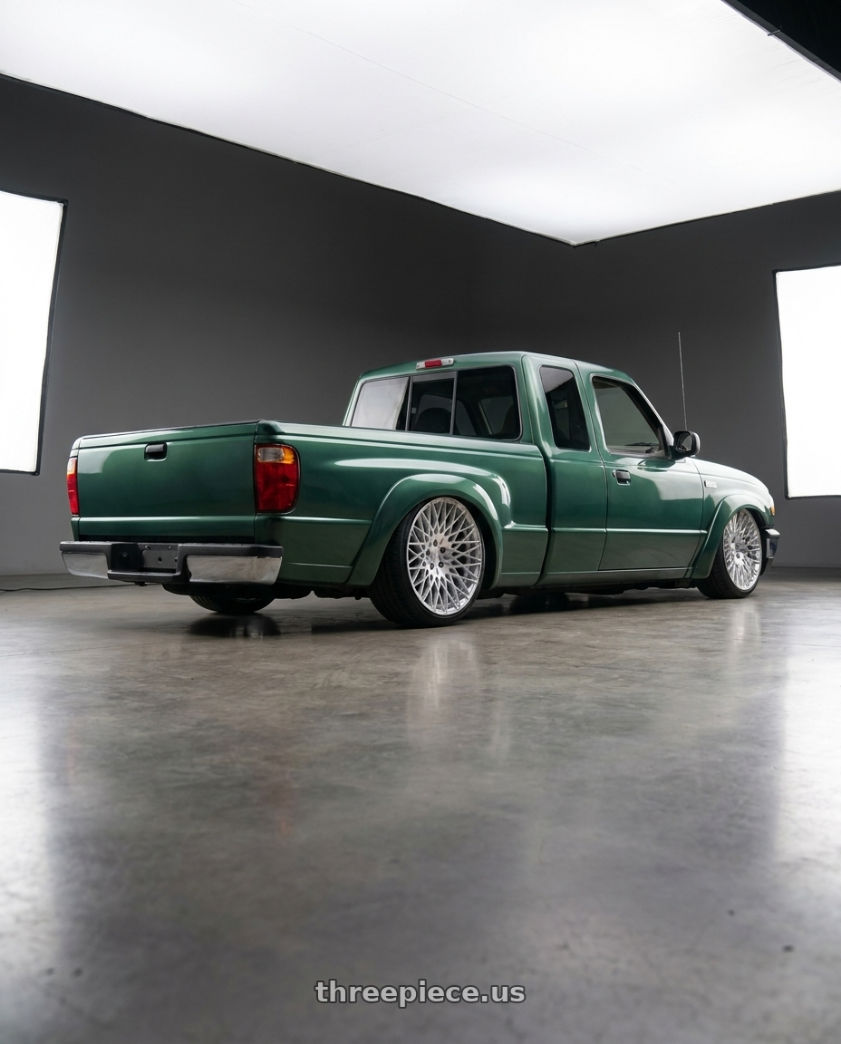 1996 Mazda b with Avant Garde Wheels M540 5X112 18x9 +48 Silver Machined wheels rear three quarter view slight stretch tires