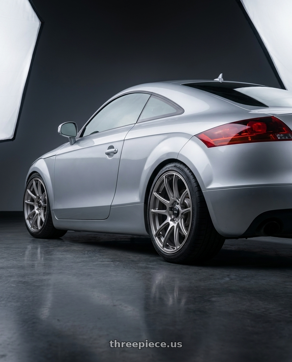 2008 Audi TT with Konig Heliogram 5X112 19x8.5+43 Titanium Metallic Knurled Bead Flow Formed wheels rear three quarter view square tires