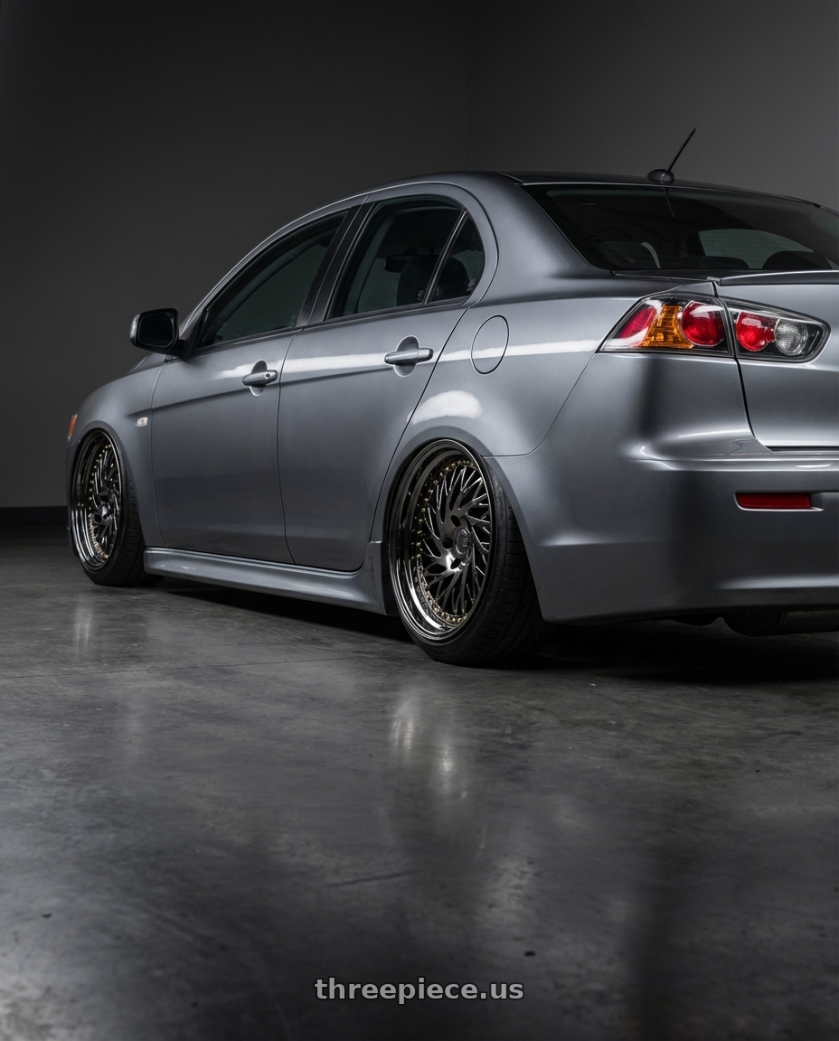 2014 Mitsubishi Lancer Ralliart with Aodhan DS03 5x114.3 18x9.5 +30 Black Vacuum w/ Gold Rivets wheels rear three quarter view slight stretch tires
