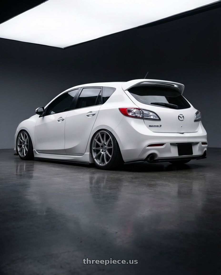 2012 Mazda Mazdaspeed3 with Ssr Gtv02 5x114.3 18x8.5+40  GLARE SILVER wheels rear three quarter view slight stretch tires